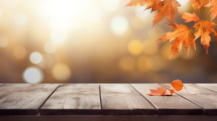 Sticker - Wooden table with brown leaves and blurred autumn background.