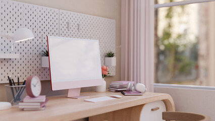 A beautiful female home study table or working desk in pink with a pink computer mockup.