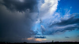 Fototapeta Na sufit - Stormy sky with dramatic clouds from an approaching thunderstorm at summer sunset