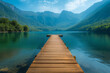Wooden pier at the mountains lake.