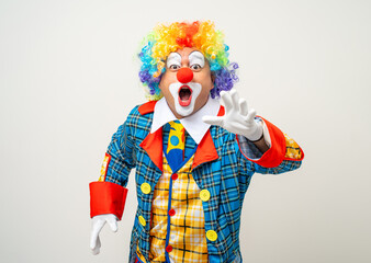 Wall Mural - Mr Clown. Portrait of Funny face Clown man in colorful uniform standing variety action. Happy expression male bozo in various pose on isolated background.