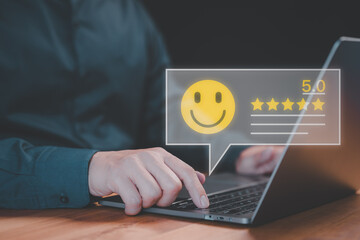 Fototapete - Client use a laptop give point with virtual screen on smile face icon for satisfaction in opinion and service. Customer satisfaction survey, service rating online, testimonial feedback review.