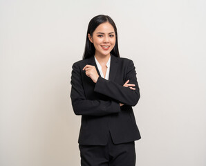 Attractive Young asian business woman smiling to camera standing pose on isolated white background. Latin Female around 25 in black suit portrait shot in studio.