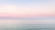 Clear Blue Sky Sunset With Glowing Pink And Purple Horizon On Calm Ocean Seascape Background. Picturesque Generative Ai