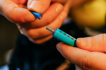 Poster - Male hands holding syringe with thermal paste close up