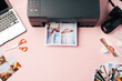 © fotofabrika - Printer, laptop and camera on table close up. Printing photos