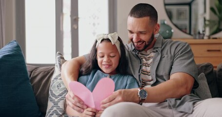 Wall Mural - Dad, daughter and fathers day card on sofa with smile, love and fun surprise from child in home. Heart, gift and giving, happy holiday celebration with man and kid on couch in living room with care.