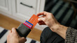 © mahirkart - Close-up of young man hand opens card wallet full of credit cards, takes one out