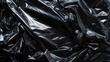 Fototapeta Przestrzenne - Wrinkled plastic wrap texture on a black background