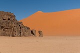 Fototapeta  - View of Dunes of Ouan Zaoutan, sand dunes in Tadrart Rouge, Tassili n Ajjer National Park. Sahara, Algeria, Africa.