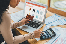 Woman Shopping Online On Internet Marketplace Browsing For Sale Items For Modern Lifestyle And Use Credit Card For Online Payment From Wallet Protected By Crucial Cyber Security Software