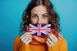 © fidaolga - A female English speaker with a British flag