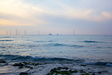 Canvas Print - 
This is a beach where the sunset is setting.