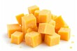 White background with cheddar cheese cubes isolated