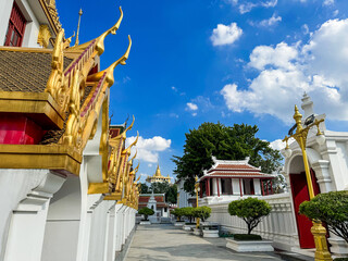 Wall Mural - A picture of a Thai temple in bright brass color overlooking the Golden Mountain of Wat Saket.