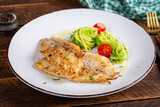 Fototapeta Tęcza - Grilled fish fillet with zucchini pasta. Healthy food concept.