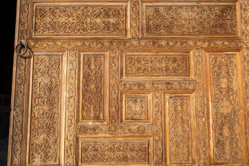 Wall Mural - beautiful wooden door design in a historical fashion in the entrance of a historical place