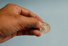 Close Up Of Hand Holding 2 Dollar Coin Hongkong. Charity Concept.