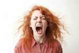 Fototapeta  - Portrait of young angry woman screaming on white background