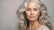 © Wirestock - AI generated illustration of a beautiful, elegant elderly woman's portrait against a gray background