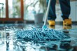 Professional concept of cleaning man holding plastic mop washing dirty floor in closeup background