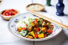 halloumi pieces in a rainbow vegetable stir-fry