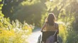 Young woman in a wheelchair walking in the park. Back view. AI generated