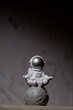 © anna.stasiia - Plastic toy figure astronaut on moon concrete background Copy space. Concept of out of earth travel, private spaceman commercial flights. Space missions and Sustainability