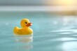 Yellow rubber duck floating on the water of the bathtub