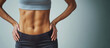 © Rymma - Generative AI, Sporty woman with great abdominal muscles shows stomach in sportswear on neutral background