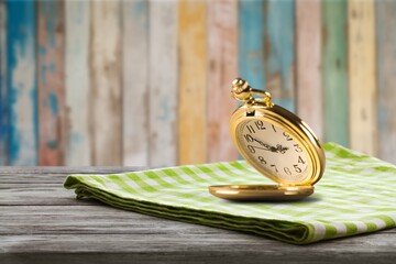 Wall Mural - vintage golden pocket watch on the desk