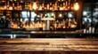 Bar table interior in pub with wooden counter background desk space blurred light for drink design cafe top in coffee restaurant vintage retro style wine shop brown alcohol abstract blurry kitchen