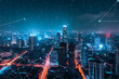 city at night with skyline view and technology signal network