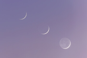 Wall Mural - As the crescent moon sets, the Earth-shine phenomenon appears.