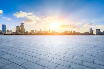 Wall Mural - Empty square floor and city skyline with modern buildings scenery at sunset in Shanghai. Famous Bund landmark in Shanghai.
