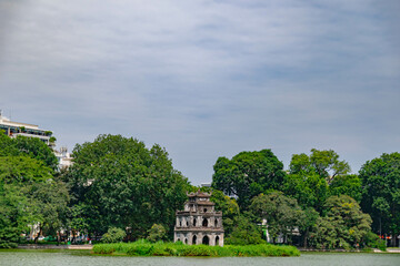 Wall Mural - Hoan Kiem lake with blue sky, green tree and temple in Ha Noi capital, Vietnam. 