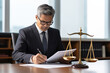 © Alexander - male lawyer working