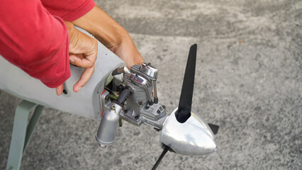 Engineer designing and assembling drones. Homemade aircraft made from resin and carbon fiber