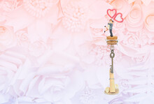 Miniature Couple On Message In The Bottle On Flower Pattern Background, Love And Romance Concept, Velentine Card Background Idea