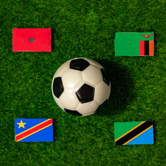 Flags of the teams participating in Group F of the 2024 African Cup of Nations. Morocco, Zambia, DR Congo, Tanzania.