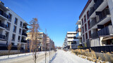 Fototapeta Uliczki - Residential area with modern, new and stylish living blocks of flats in winter time. 