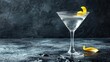  a close up of a martini glass with a lemon garnish on the rim and a slice of lemon on the rim.