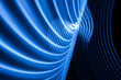 Technology futuristic abstract background neon blue light stripes on black. High quality photo