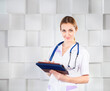 © Dasha Petrenko - Female doctor with tablet computer