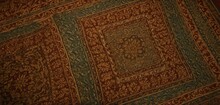  A Close Up Of A Rug With An Animal Laying On It's Back In The Middle Of A Room With A Red Carpet And Green Rug On The Floor.