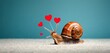  a snail with a bunch of red hearts on it's back sitting on the ground with a stick in it's mouth in front of a blue background.