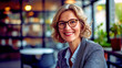 © PETR BABKIN - Portrait of a Smiling Professional Businesswoman