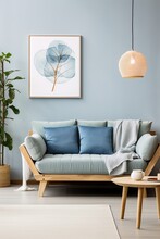 Blue and green living room interior with a tree graphic, a comfortable sofa, and a round coffee table