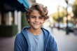 © Igor - Portrait of a smiling boy looking at camera in the street.