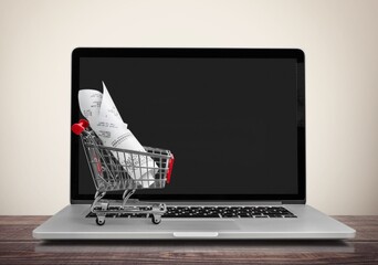 Poster - Laptop computer and shopping cart on desk